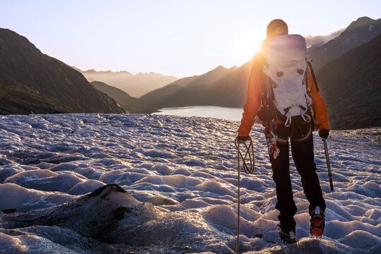 mountain girl leading glacier trek in the swiss alps