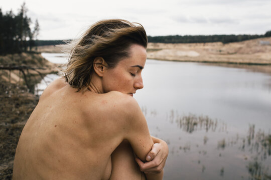 Young naked woman in nature