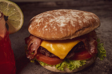 Tasty burger on rustic background