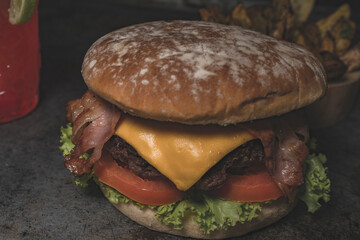 Burger ingredients isolated on rustic background.