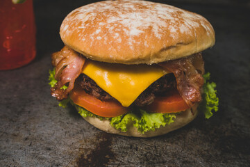 Tasty burger on rustic background