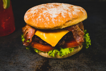 Burger ingredients isolated on rustic background.