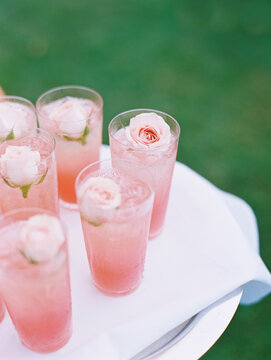 PInk drinks with flowers at wedding