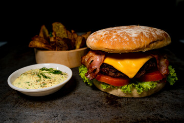 Tasty burger on rustic background
