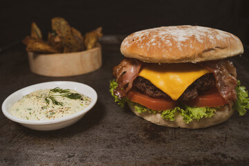 Tasty burger on rustic background
