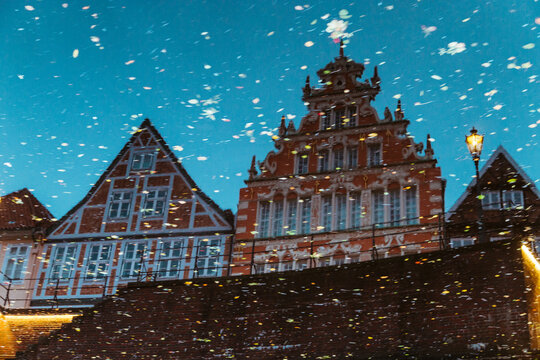 Reflection of 17th century houses in river water.