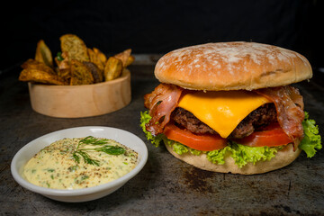 Tasty burger on rustic background