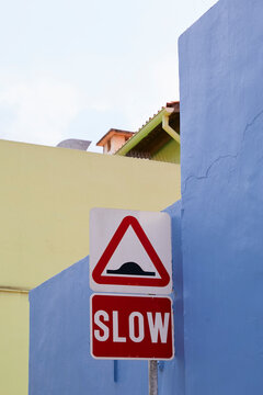 Warning road sign on colourful building