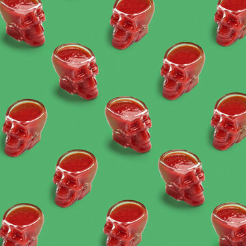 Pattern of glass skulls on green.