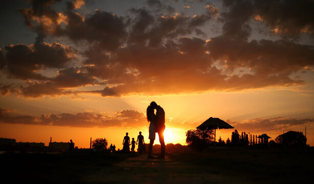 kissing couple in a beautiful sunset