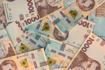 Fototapeta na wymiar UAH. Background of new 1000 banknote of Ukraine. Same and money cocncept.
