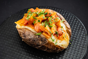 baked potato on the black background