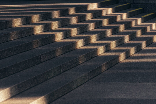 Sunlight on gray stone stairs