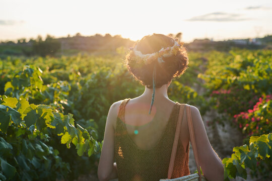 Brunette watching sunset in countryside