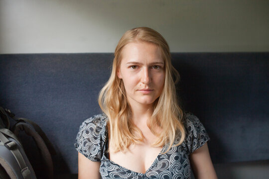 portrait of a blonde girl in a train car
