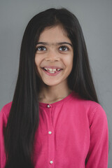 Fototapeta premium School age girl of British Indian descent displays different facial expressions.