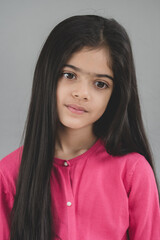 Fototapeta premium School age girl of British Indian descent displays different facial expressions.