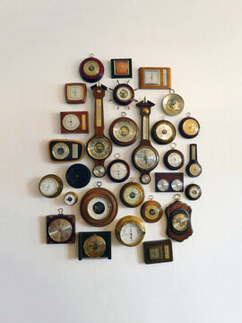 Vintage barometers on wall in a home