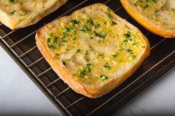 Homemade fresh slices of garlic bread