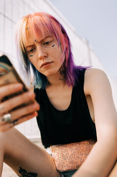 Young Woman With Tattoo On Her Face