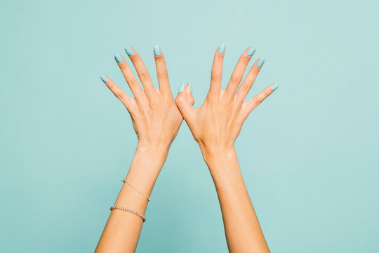 Hands Against blue background