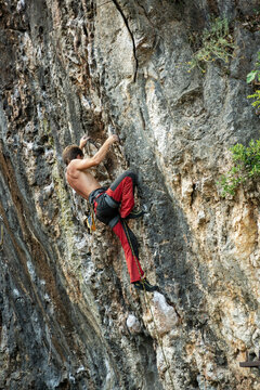 Anonymous guy rock climbing