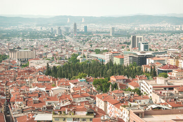 Fototapeta na wymiar Bursa city center scene from Tophane. Top view of Yalova street. Bursa is 4th largest city in Turkey.