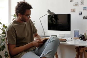 African American Student Reading Book