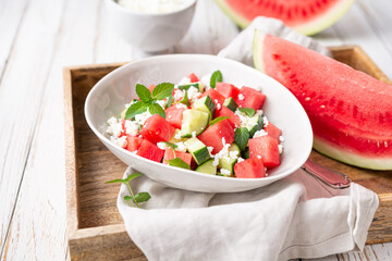 Mediterranean watermelon salad with Feta cheese, cucumber and mint leaves