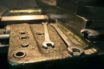 Chromed wrenches are on an old lathe. Lathe repair.