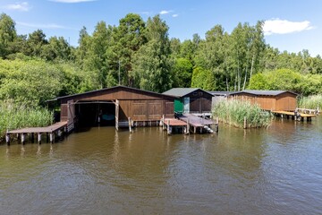 Fototapeta na wymiar typical boat shacks in the Mecklenburg Lake District, Germany