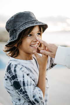 Portrait of a smiling kid with a hat