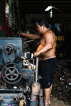 Man working in a mechanical workshop in Vietnam