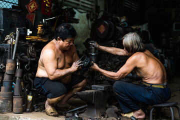 Man working in a mechanical workshop in Vietnam