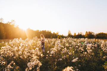 Carefree woman walking at sunset