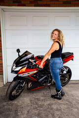 Fototapeta na wymiar Cute girl and motocycle