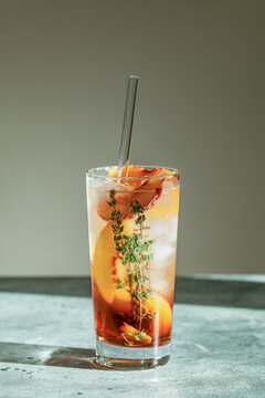 Refreshing Peach Iced Tea Cuba Libre Or Long Island Iced Tea Cocktail In Glass With Straw. Summer Refreshing Fruit Drink. Selective Focus