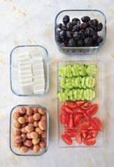 Top view of olives, tomatoes, cucumber and feta cheese on table. Traditional Turkish breakfast. Diet breakfast concept.