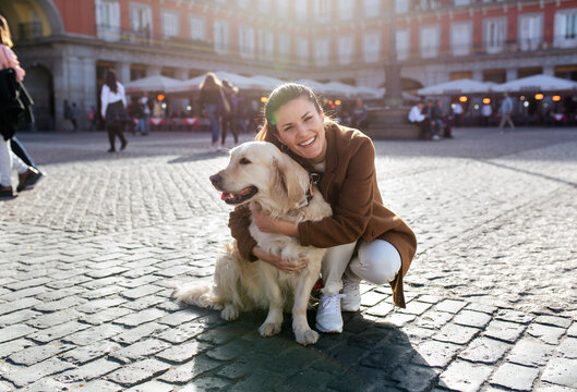 Pretty young woman with her dog