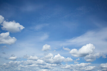 Obraz premium Cumulus clouds against a blue sky.