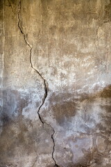 abandoned grunge cracked stucco wall background texture.
