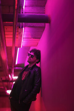 Attractive boy having fun in night club.