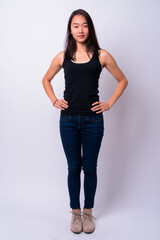 Full body shot of young beautiful Asian woman
