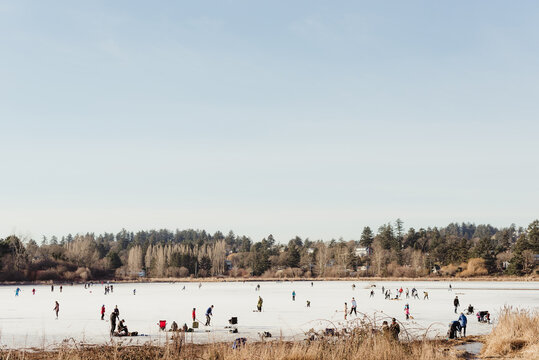 Winter Ice Skating on a Pond