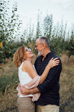 Senior Couple In The Orchard