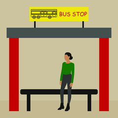 Young woman waiting for a bus at a bus stop