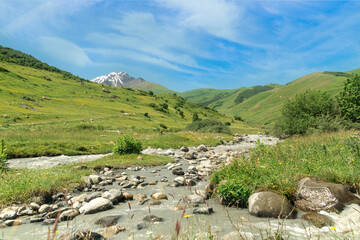 Fototapeta na wymiar Mountain river valley path panoramic landscape in sunny day. Nature background
