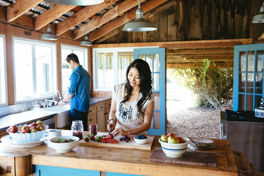 Multi-ethnic couple in farmhouse kitchen