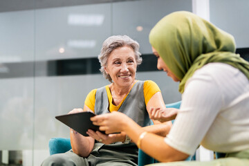 multinational team concept. muslim woman in hijab and caucasian
