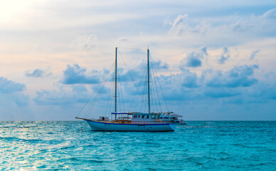 Fototapeta na wymiar Yacht near the pier of a fabulous island in the Maldives.